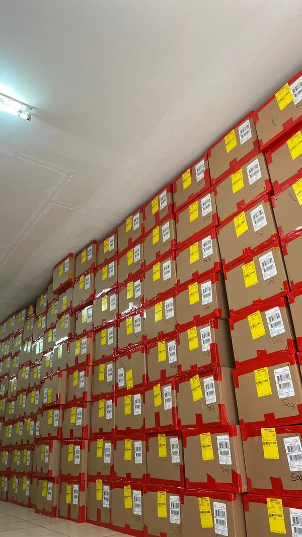 Stacked and labelled stock on warehouse shelving